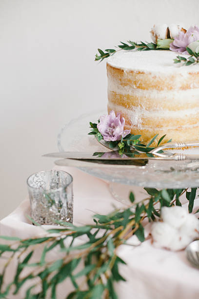 istock Beautiful wedding round cake with floral decorations. 626700466