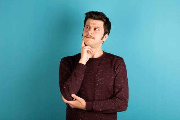 istock Portrait of young thoughtful man. 626702294