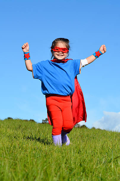 istock Superhero child - girl power 626702498
