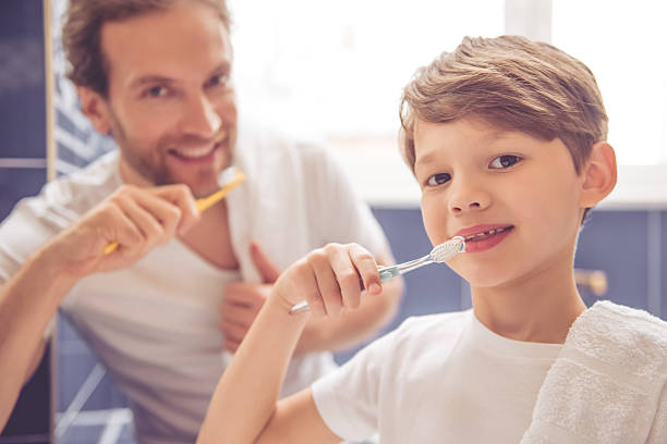 istock Father and son in bathroom 626702618
