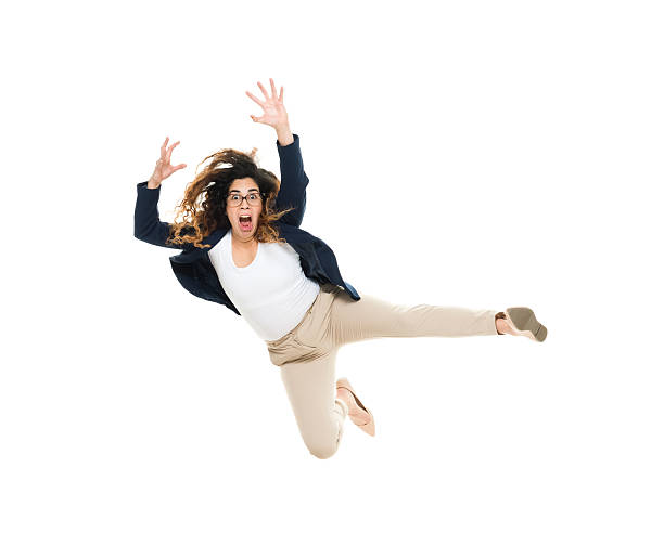 istock Businesswoman jumping and looking angry 626703054