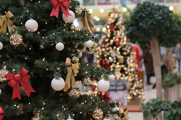 christmas tree with decorations at shopping center olympia - christmas shopping imagens e fotografias de stock