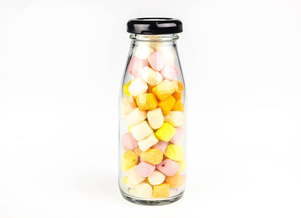 marshmallows in beautiful glass on white backgroundmarshmallows in beautiful glass on white background