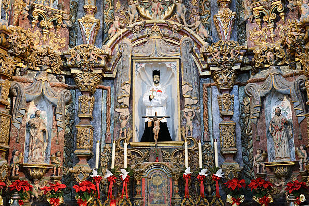 Statuary and mural paintings inside San Xavier Mission Statuary and mural paintings inside San Xavier Mission, Tucson, Arizona, USA. San Xavier Mission is a Catholic mission founded in 1692. It is a national historic landmark located 9 miles south of downtown Tucson. The mission 's interior is filled with original statues and mural paintings of 18th century. It is a popular tourist destination. tucson christmas stock pictures, royalty-free photos & images