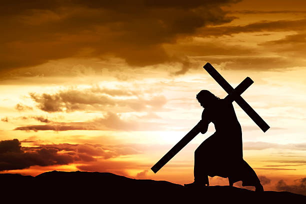 istock Silhouette of Jesus carry his cross 626707886