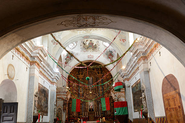 Christmas Decoration inside San Xavier Mission Inside San Xavier Mission, Tucson, Arizona, USA. San Xavier Mission is a Catholic mission founded in 1692. It is a national historic landmark located 9 miles south of downtown Tucson. The mission 's interior is filled with original statues and mural paintings of 18th century. It is a popular tourist destination. tucson christmas stock pictures, royalty-free photos & images