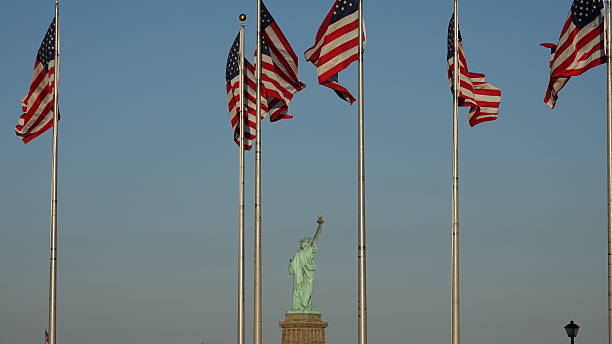 istock Us Flags And Statue Of Liberty 626708860