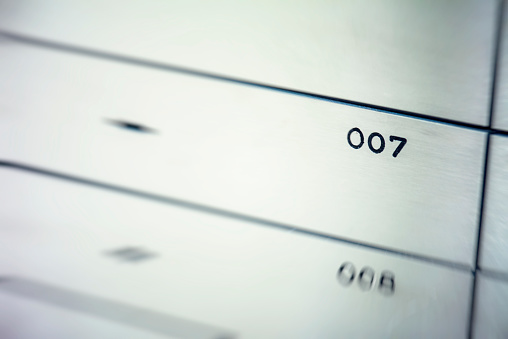 Really close up shot of a safety deposit box with the number 007.