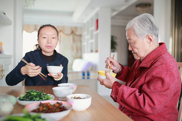 istock Happy Asian family enjoying lunc 626723640