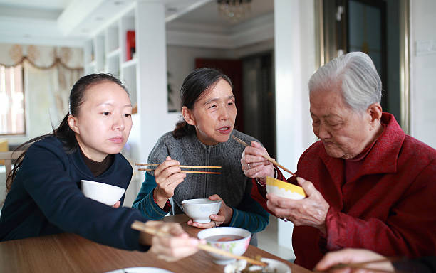 istock Happy Asian family enjoying lunc 626723686