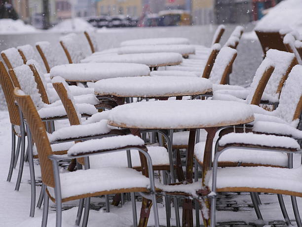 istock snowy chairs tables winter 626741998