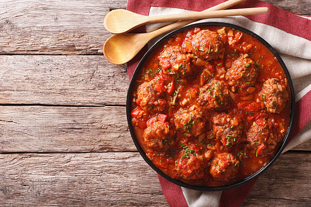 istock Meatballs with spicy tomato sauce on plate on the table 626751874