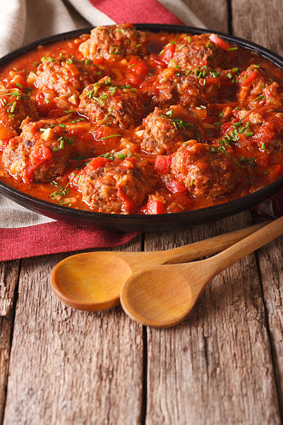 istock Albondigas meatballs with tomato sauce on a plate close-up. Vertical 626752174