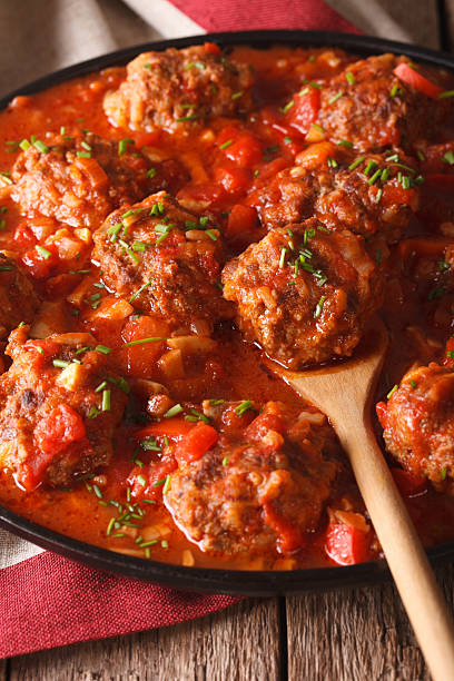 istock Albondigas meatballs with spicy sauce on a dish close-up. vertical 626752426