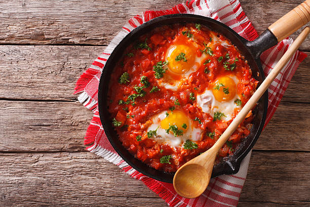 istock Shakshuka breakfast of fried eggs and tomatoes in a pan 626752582