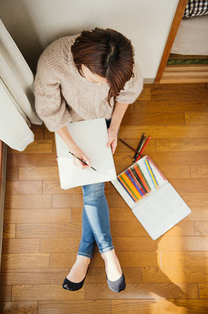 istock Woman drawing and playing in house 626753324