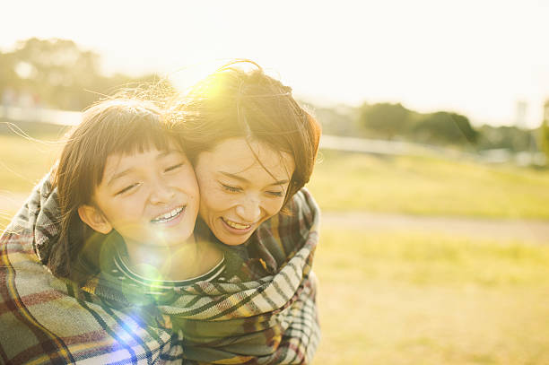 istock Mother hugging daughter in outdoors 626753994