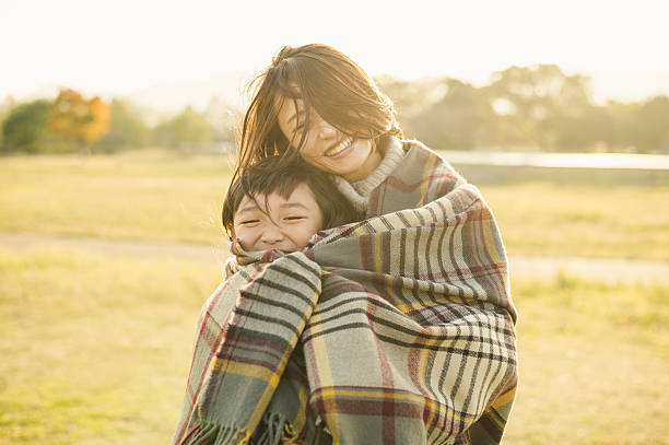 istock Mother hugging daughter in outdoors 626754024