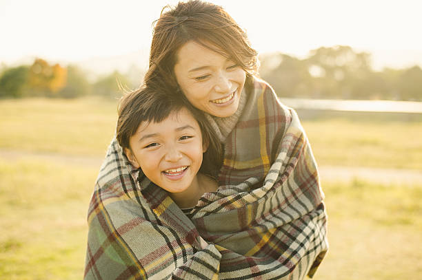 istock Mother hugging daughter in outdoors 626754048