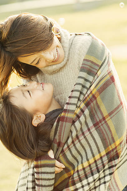 istock Mother hugging daughter in outdoors 626754778