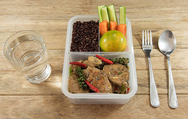 istock Spicy stir-fried catfish and riceberry in lunch box, 626754794