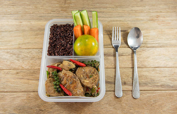 istock Spicy stir-fried catfish and riceberry in lunch box, 626754834