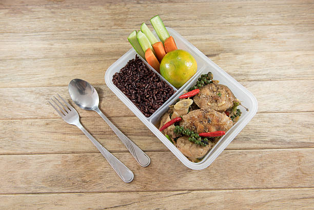istock Spicy stir-fried catfish and riceberry in lunch box, 626754868
