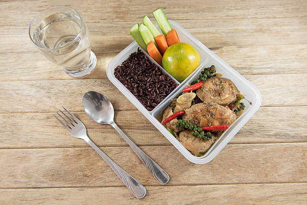 istock Spicy stir-fried catfish and riceberry in lunch box, 626754908