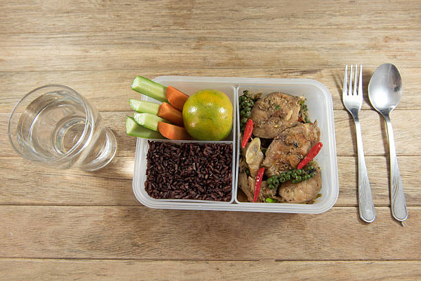 istock Spicy stir-fried catfish and riceberry in lunch box, 626755910