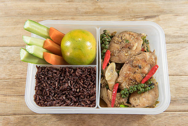 istock Spicy stir-fried catfish and riceberry in lunch box, 626755942