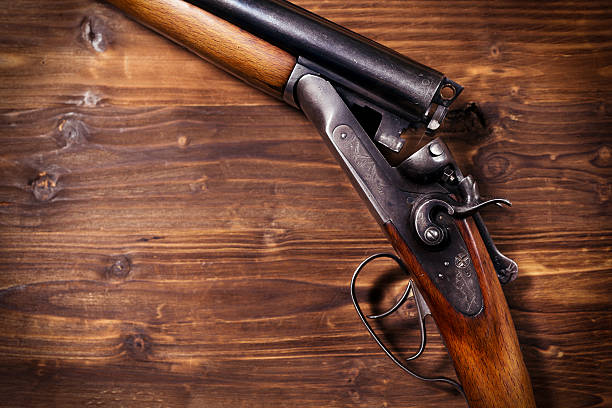 istock Shotgun on wooden background 626771204
