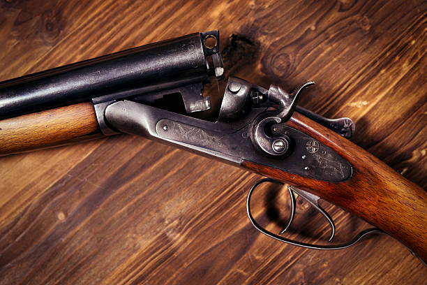 istock Shotgun on wooden background 626771256