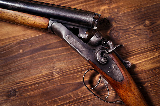 istock Shotgun on wooden background 626771368
