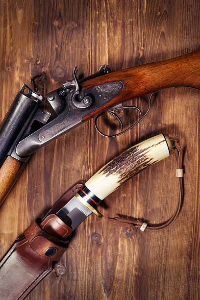 istock Shotgun on wooden background 626771442