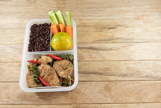 istock Spicy stir-fried catfish and riceberry in lunch box, 626771450