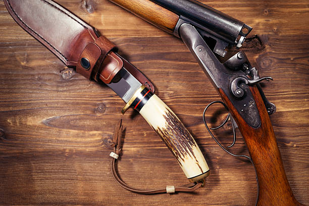 istock Shotgun on wooden background 626771514