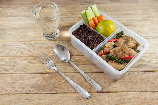 istock Spicy stir-fried catfish and riceberry in lunch box, 626771526