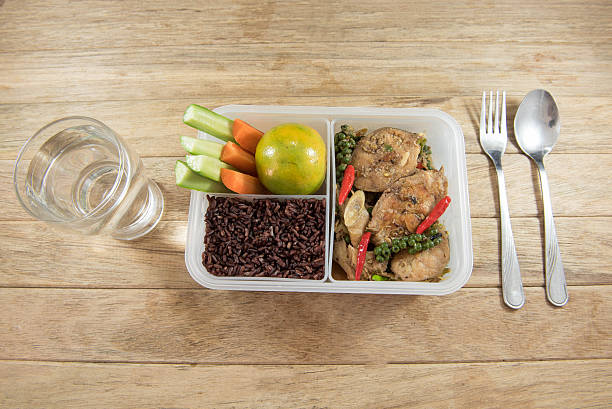 istock Spicy stir-fried catfish and riceberry in lunch box, 626771756