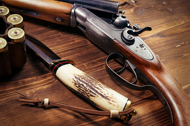 istock Shotgun on wooden background 626771784
