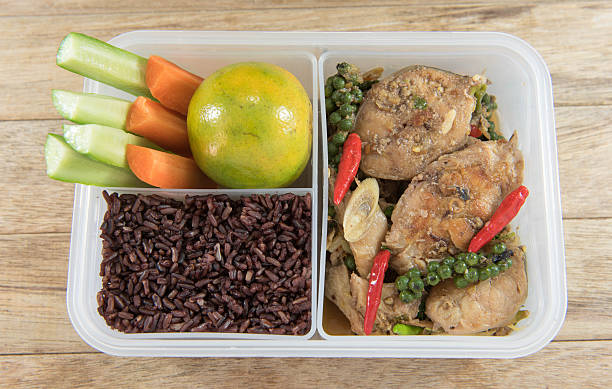 istock Spicy stir-fried catfish and riceberry in lunch box, 626771794