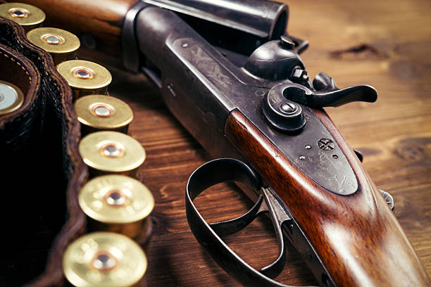 istock Shotgun on wooden background 626771936