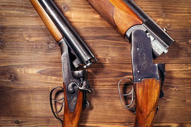 istock Shotgun on wooden background 626772094
