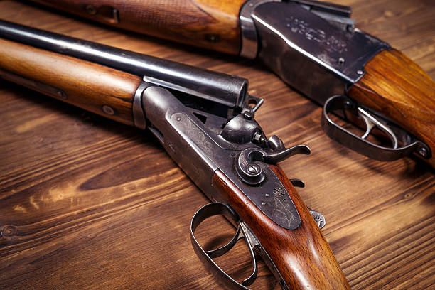istock Shotgun on wooden background 626772168