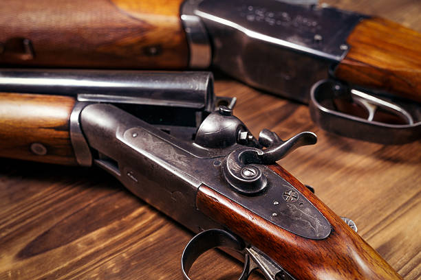 istock Shotgun on wooden background 626772232