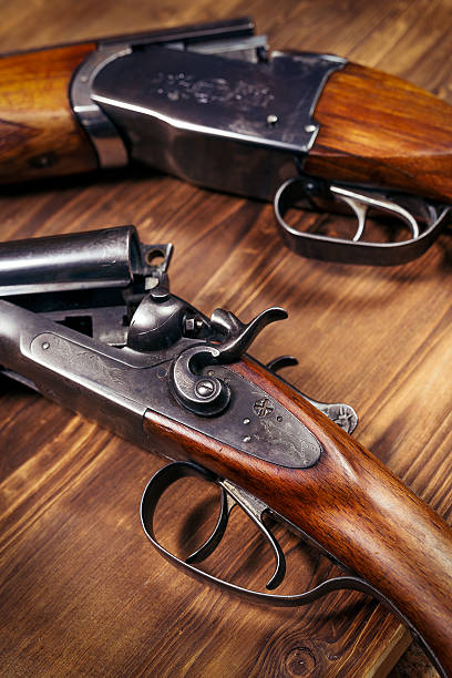 istock Shotgun on wooden background 626772296