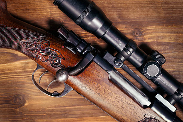 istock Shotgun on wooden background 626772584