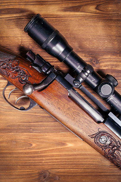 istock Shotgun on wooden background 626773486