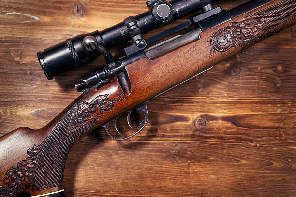 istock Shotgun on wooden background 626773690