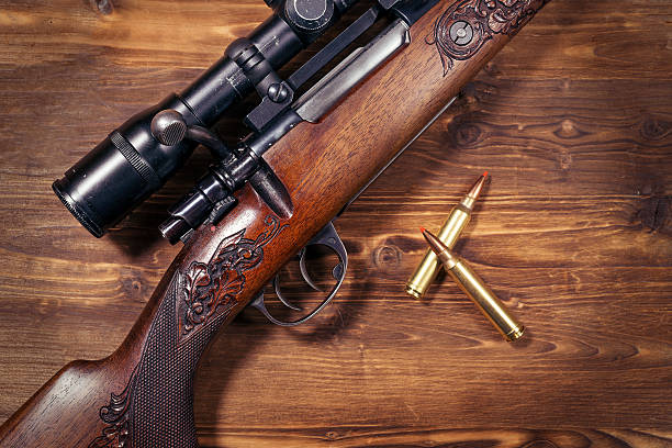 istock Shotgun on wooden background 626773840
