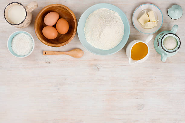 istock Various bakery ingredients on wood textured table, view from above 626775766